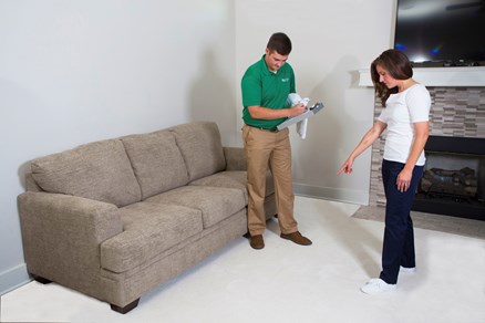 Chem-Dry by Leonard technician with customer in home point to carpet preparing for a carpet cleaning